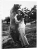 Woman embraces a stuffed bear, ca. 1940 by Anonymous