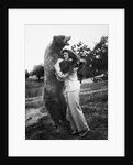 Woman embraces a stuffed bear, ca. 1940 by Anonymous