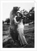 Woman embraces a stuffed bear, ca. 1940 by Anonymous