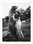 Woman embraces a stuffed bear, ca. 1940 by Anonymous