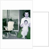 Proud new mother with baby, ca. 1956. by Anonymous
