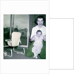 Proud new mother with baby, ca. 1956. by Anonymous