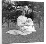 OIder woman and baby in a English park, ca. 1900. by Anonymous