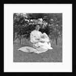 OIder woman and baby in a English park, ca. 1900. by Anonymous