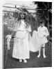 Young girl and attending young boy, ca. 1900. by Anonymous