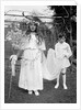 Young girl and attending young boy, ca. 1900. by Anonymous