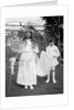Young girl and attending young boy, ca. 1900. by Anonymous