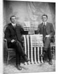 Two men pose with American flags, ca. 1895. by Anonymous