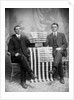 Two men pose with American flags, ca. 1895. by Anonymous