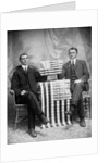 Two men pose with American flags, ca. 1895. by Anonymous