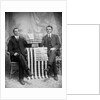 Two men pose with American flags, ca. 1895. by Anonymous
