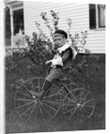 Toddler on a period tricycle, ca. 1895. by Anonymous