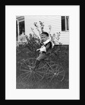 Toddler on a period tricycle, ca. 1895. by Anonymous