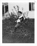 Toddler on a period tricycle, ca. 1895. by Anonymous