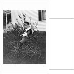 Toddler on a period tricycle, ca. 1895. by Anonymous