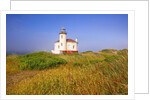 Morning light adds beauty to fog and Coquille River Lighthouse, Bandon, Oregon Coast, Pacific Ocean, by Anonymous