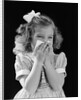 1940s little blond girl ribbon in hair holding tissue to nose sneezing by Anonymous