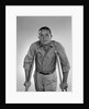 1960s man walking on crutches looking at camera by Anonymous