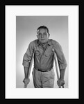 1960s man walking on crutches looking at camera by Anonymous