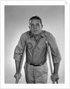 1960s man walking on crutches looking at camera by Anonymous