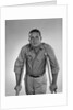 1960s man walking on crutches looking at camera by Anonymous