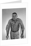 1960s man walking on crutches looking at camera by Anonymous