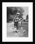 1950s boy plaid shirt sailor hat fishing pole dog pulling on tail of caught fish by Anonymous