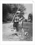 1950s boy plaid shirt sailor hat fishing pole dog pulling on tail of caught fish by Anonymous