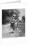 1950s boy plaid shirt sailor hat fishing pole dog pulling on tail of caught fish by Anonymous
