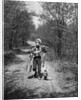 1950s boy beagle puppy walking down country road whistling carrying fishing pole pail fish by Anonymous