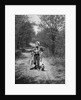 1950s boy beagle puppy walking down country road whistling carrying fishing pole pail fish by Anonymous