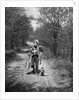 1950s boy beagle puppy walking down country road whistling carrying fishing pole pail fish by Anonymous