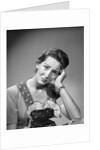 1950s housewife woman in print apron hand up to temple headache pain sad depressed facial expression worried serious looking at camera by Anonymous
