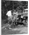 1920s 1930s couple man woman in fishing gear holding poles standing in front of packard touring automobile by Anonymous
