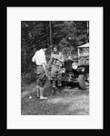 1920s 1930s couple man woman in fishing gear holding poles standing in front of packard touring automobile by Anonymous