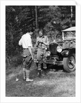 1920s 1930s couple man woman in fishing gear holding poles standing in front of packard touring automobile by Anonymous