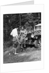 1920s 1930s couple man woman in fishing gear holding poles standing in front of packard touring automobile by Anonymous