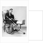 1940s man in wheelchair with cast on left leg holding crutches by Anonymous