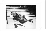 1950s woman lying on snow covered steps fall accident slip expression of pain by Anonymous