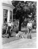 1940s boy with fishing gear collie dog second boy mowing grass with push mower by Anonymous