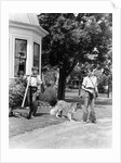 1940s boy with fishing gear collie dog second boy mowing grass with push mower by Anonymous