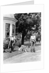 1940s boy with fishing gear collie dog second boy mowing grass with push mower by Anonymous