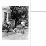 1940s boy with fishing gear collie dog second boy mowing grass with push mower by Anonymous