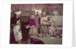 1950s 2 couples cooking picnic in rustic kitchen drinking beer by Anonymous