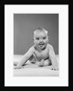 1950s portrait of baby sitting and sticking tongue out looking at camera by Anonymous