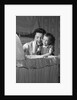 1950s mother & daughter admiring baby in bassinet by Anonymous