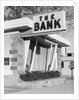1960s window storefront of bank building by Anonymous