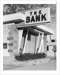 1960s window storefront of bank building by Anonymous
