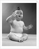 1950s full figure baby sitting gesture hand touching cheek face expression funny by Anonymous