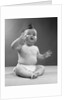 1950s full figure baby sitting gesture hand touching cheek face expression funny by Anonymous
